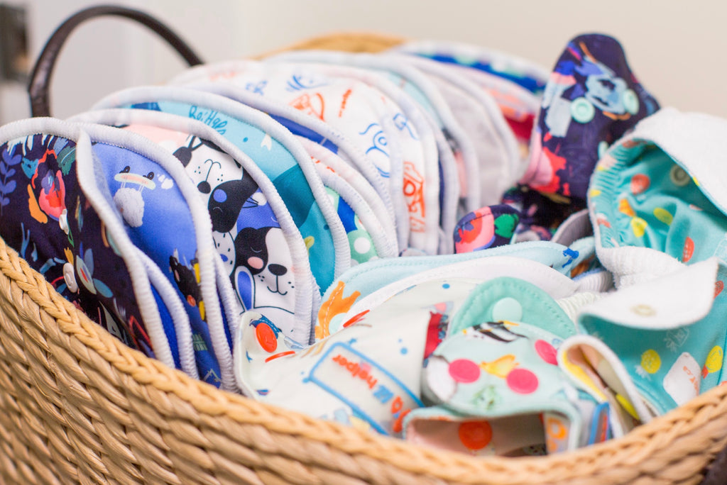 Colorful reusable pads in a woven basket