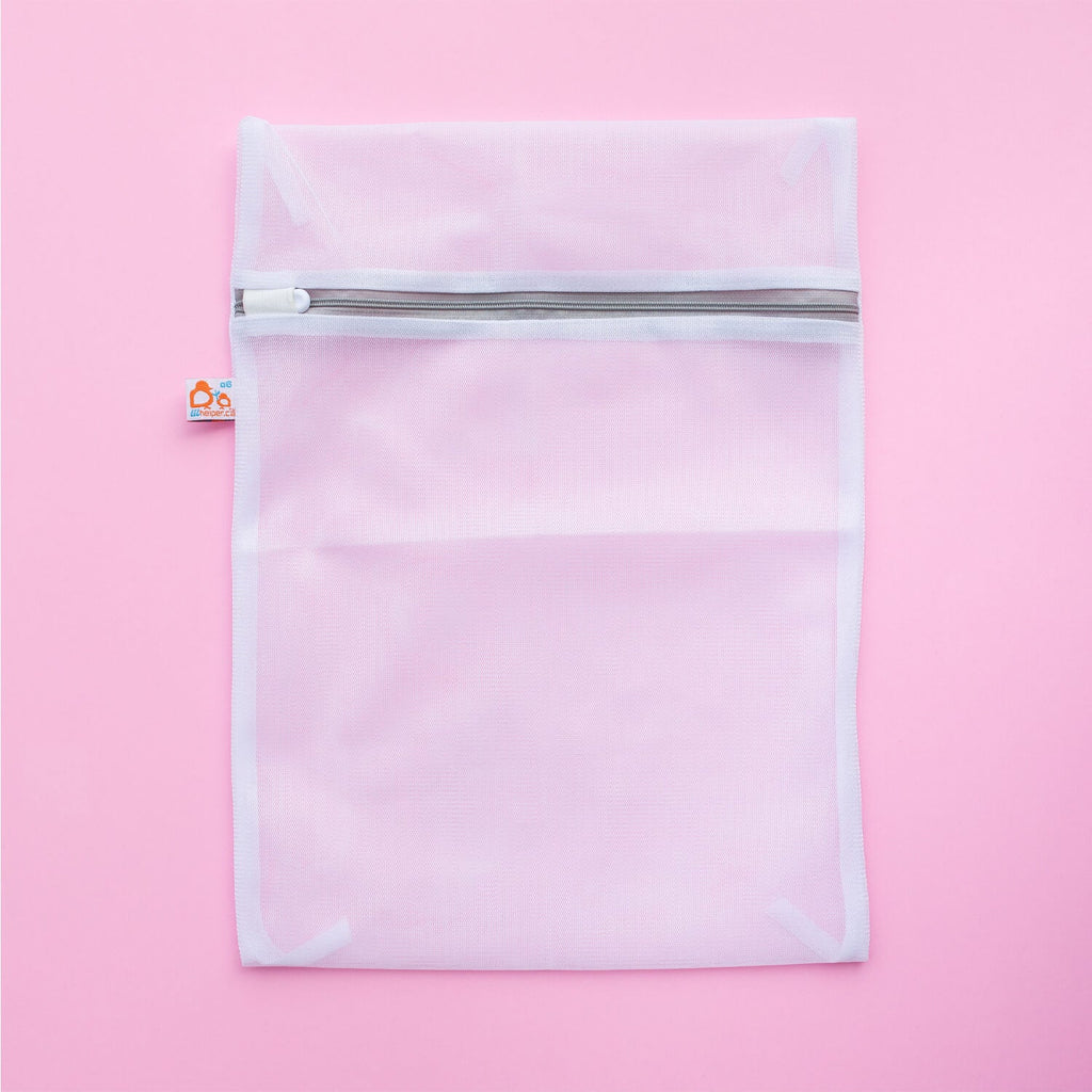 small mesh bag on pink background