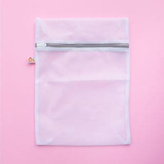 small mesh bag on pink background